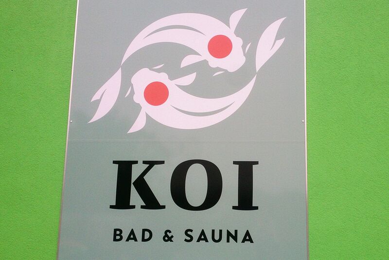 Kelly Koi sign Koi Bad & Sauna